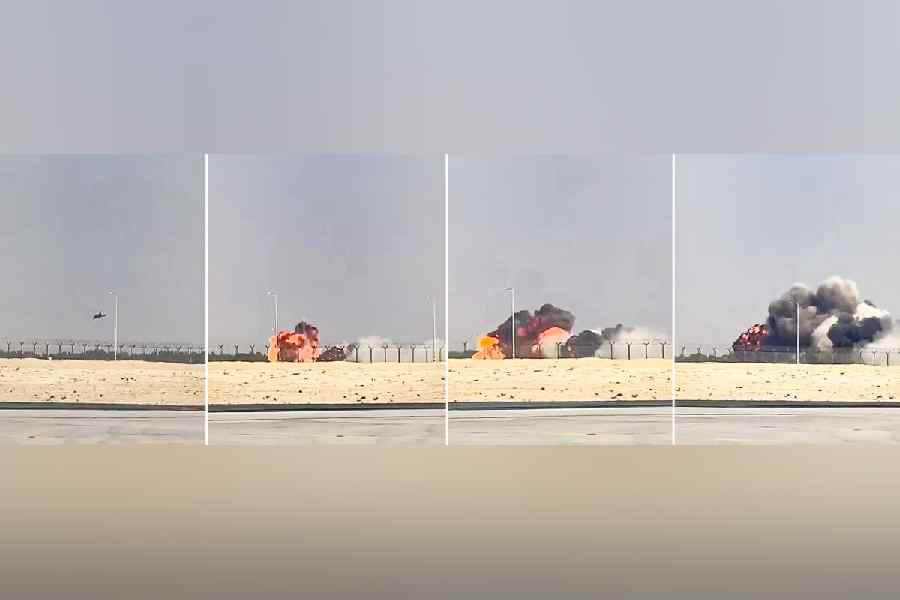 In this combo of screenshots from a third party video, a fighter jet Tejas of the Indian Air Force is seen dropping altitude and then crashing on the ground, engulfed in a ball of fire, during an aerial display at the Dubai Air Show. The pilot died in the accident, according to officials.