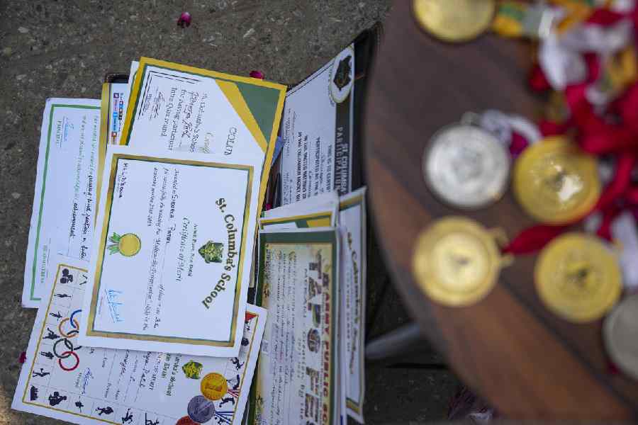 Certificates of the Class 10 student placed during a protest by his parents and school students outside St Columba's School