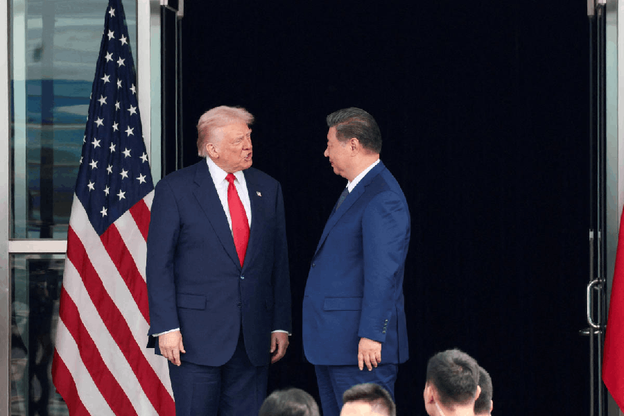 File photo: U.S. President Donald Trump and Chinese President Xi Jinping talk as they leave after a bilateral meeting at Gimhae International Airport, on the sidelines of the Asia-Pacific Economic Cooperation summit, in Busan, South Korea, October 30, 2025.