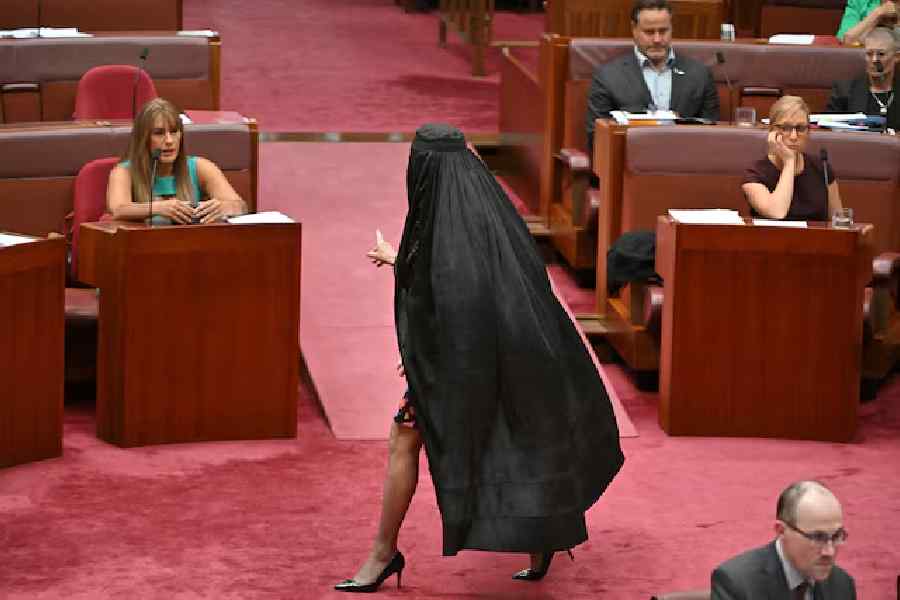 One Nation leader Pauline Hanson wears a burqa in the Senate chamber at Parliament House in Canberra, Australia, November 24, 2025.