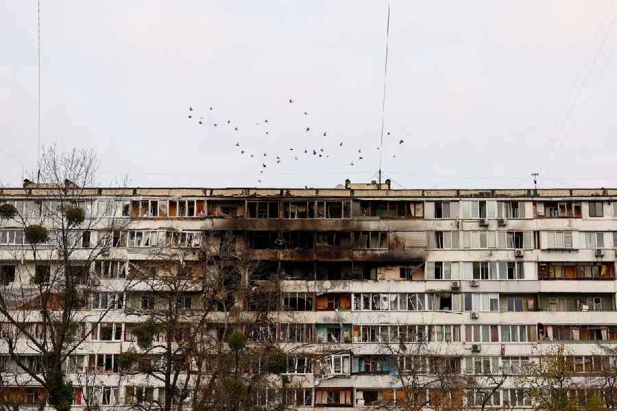 Birds fly over an apartment building hit by a Russian drone strike, amid Russia’s attack on Ukraine, in Kyiv, Ukraine November 25, 2025.