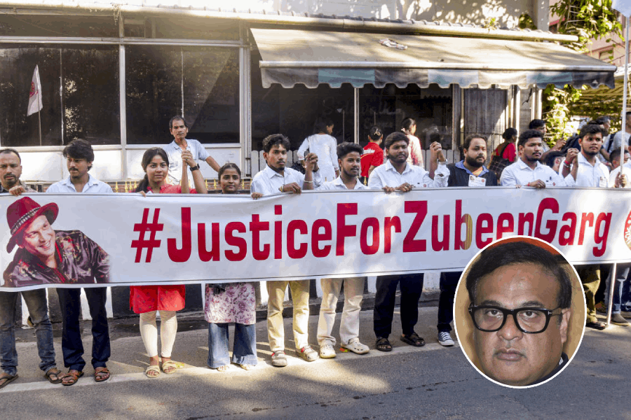 All Assam Students' Union (AASU) members stage a protest demanding justice for late singer Zubeen Garg on his 53rd birth anniversary, in Guwahati, Tuesday, Nov. 18, 2025, (inset) Assam CM Himanta Biswa Sarma.
