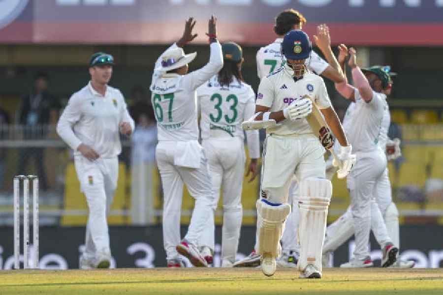 Yashasvi Jaiswal walks off after being dismissed as the South African players celebrate in Guwahati on Tuesday.