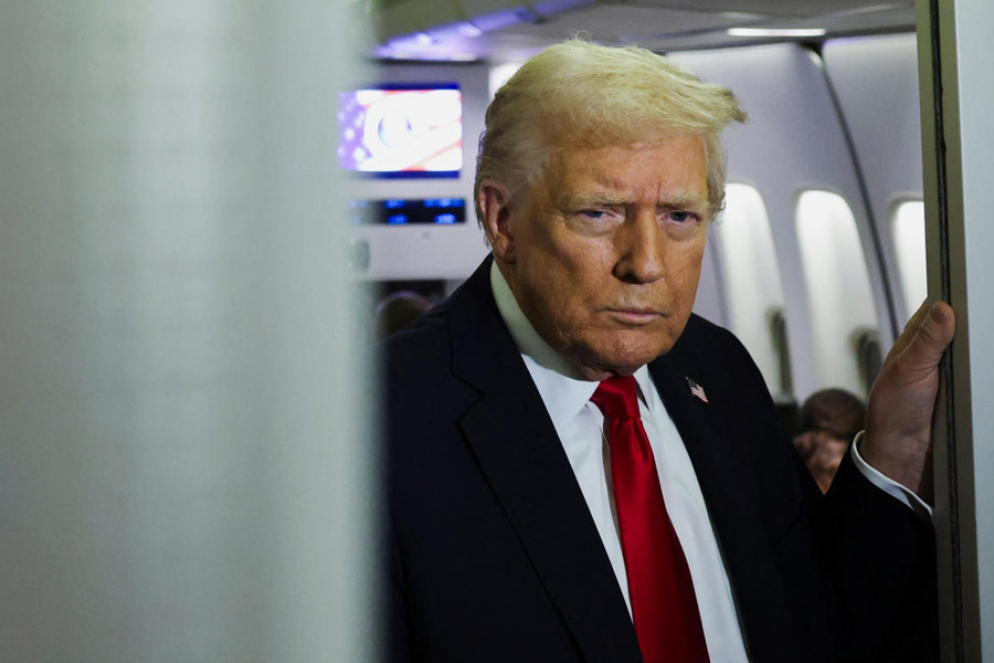 U.S. President Donald Trump looks on aboard Air Force One during travel to Palm Beach, Florida, from Joint Base Andrews, Maryland, U.S., November 25, 2025.