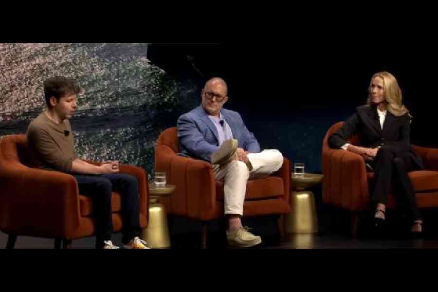 Sam Altman (left) and Jony Ive in conversation with Laurene Powell Jobs