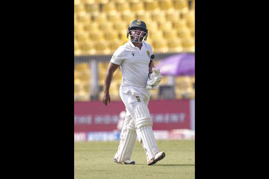 South Africa's captain Temba Bavuma walks off the field after his dismissal during the fourth day of the second Test cricket match between India and South Africa