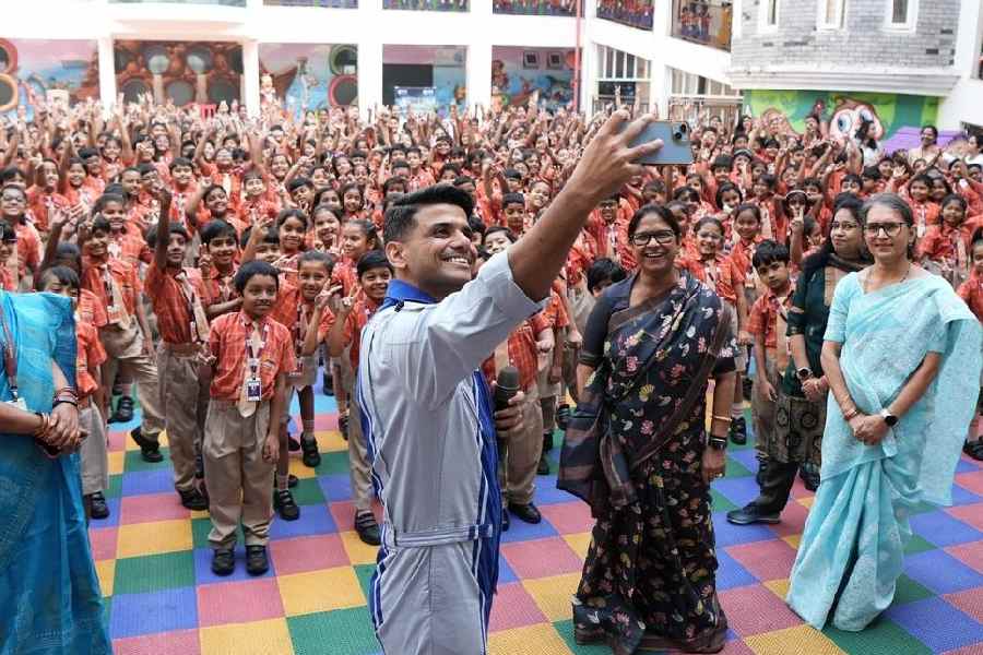 Shubhanshu Shukla clicks selfie with the students at Sai International School in Bhubaneswar on Wednesday
