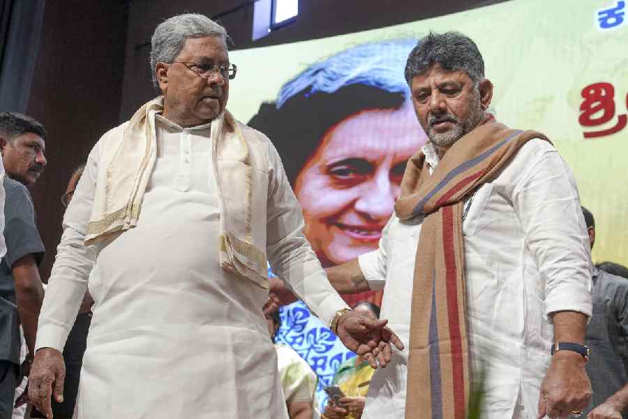 Karnataka Chief Minister Siddaramaiah and state Deputy Chief Minister DK Shivkumar during an event marking the birth anniversary of former PM Indira Gandhi, at Bharat Jodo Bhavan in Bengaluru, Wednesday, Nov. 19, 2025.