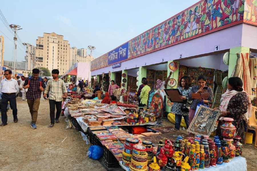 Shoppers check out patachitra items at Hastashilpa Mela in New Town.