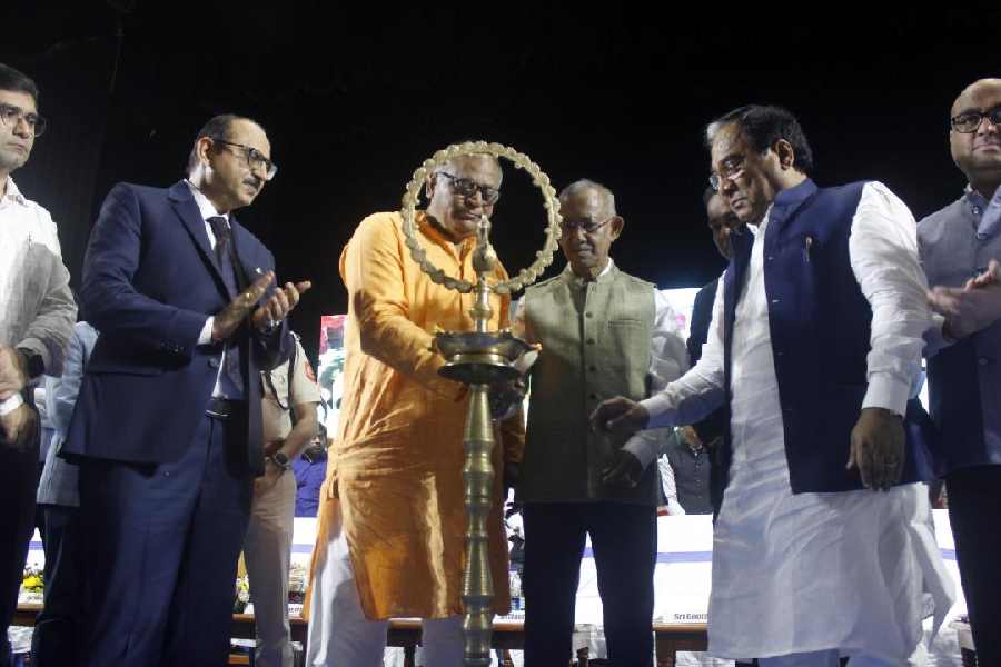 Chandranath Sinha, the state MSME minister, lights a lamp at the inauguration of the Synergy and Business Facilitation Conclave 2025-26 in Siliguri on Friday.