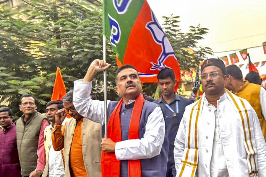 LoP in West Bengal Assembly and BJP leader Suvendu Adhikari with supporters during a protest rally against the state government, at Sainthia in Birbhum district, Tuesday, Nov. 25, 2025.