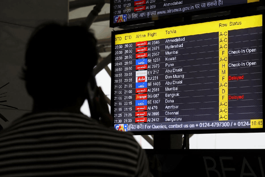 A screen displays delays in IndiGo flights at the Indira Gandhi International Airport in Delhi, India, November 29, 2025.
