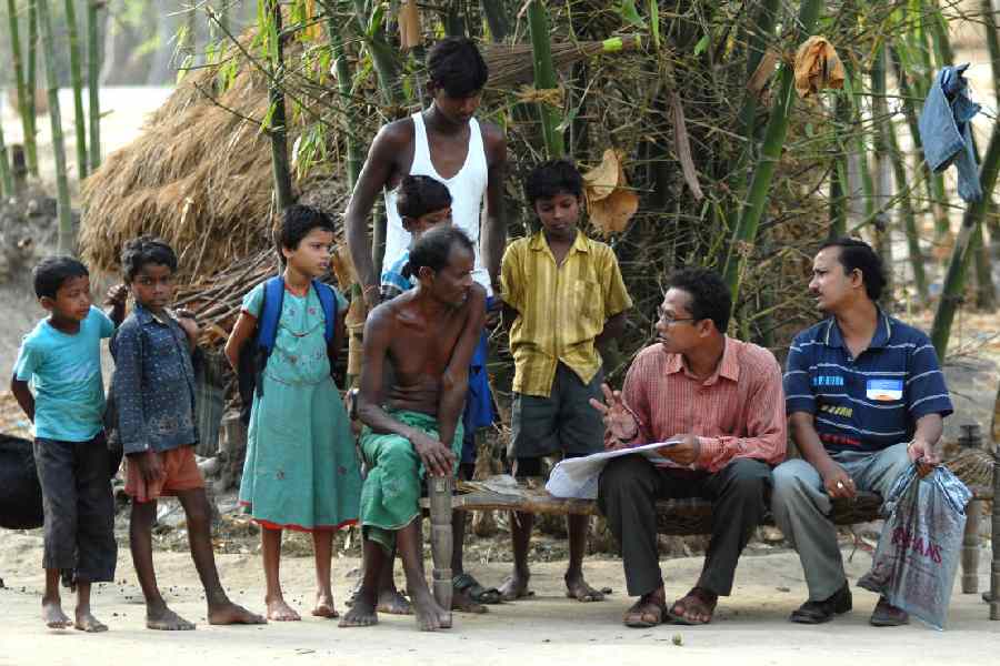 Census officials taking detail information about population from the villagers of Lalgarh.