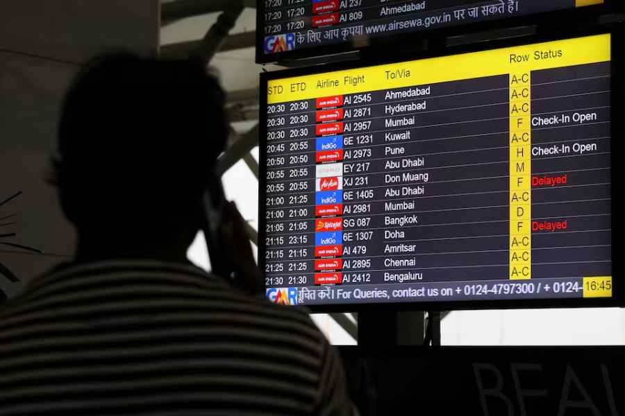 A screen displays delays in IndiGo flights at the Indira Gandhi International Airport in Delhi, India, November 29, 2025.