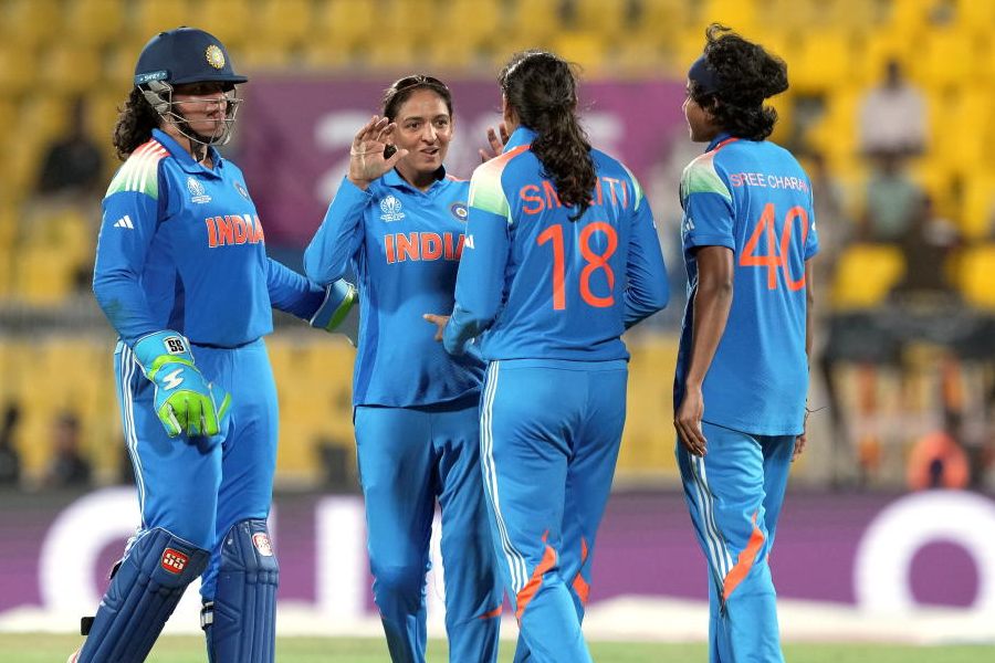 India's Shree Charani with teammates celebrates the wicket of Sri Lanka's Achini Kulasuriya during the ICC Women's Cricket World Cup 2025 match between India and Sri Lanka, at ACA Stadium, Barsapara, in Guwahati, Tuesday, Sept. 30, 2025.