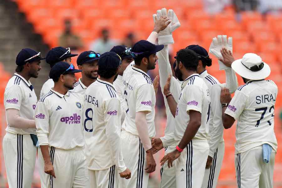 India's players celebrates the dismissal of West Indies' John Campbell on the first day of the first Test cricket match between India and West Indies at Narendra Modi Stadium in Ahmedabad, India, Thursday, Oct. 2, 2025.