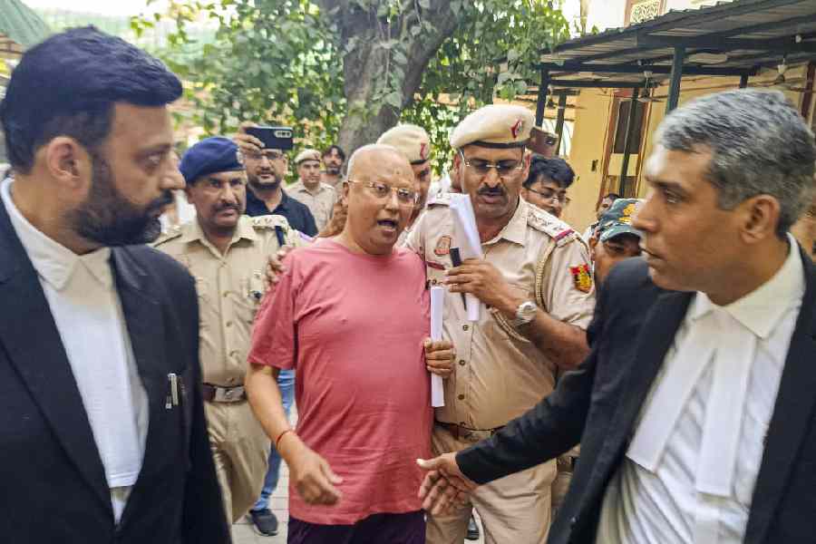 Self-styled godman Chaitanyananda Saraswati, who allegedly sexually harassed 17 women students at a private institute in Agra, being produced at the Patiala House Court, in New Delhi, Sunday, Sept. 28, 2025
