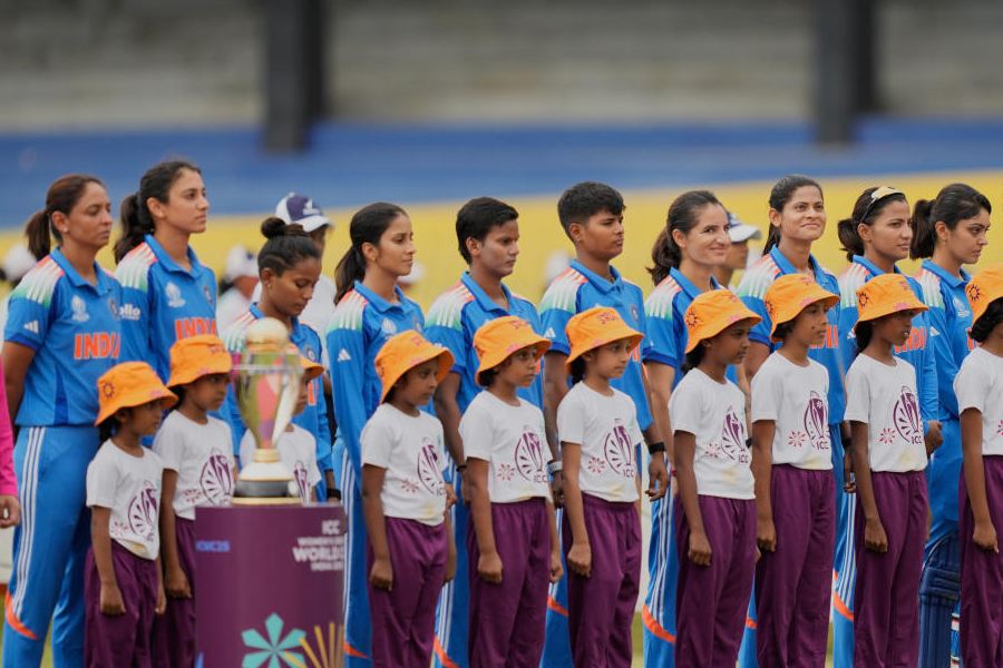 India's team members stand for their national anthem before the ICC Women's Cricket World Cup match between India and Pakistan at Premadasa Stadium in Colombo, Sri Lanka, Sunday, Oct, 5, 2025.