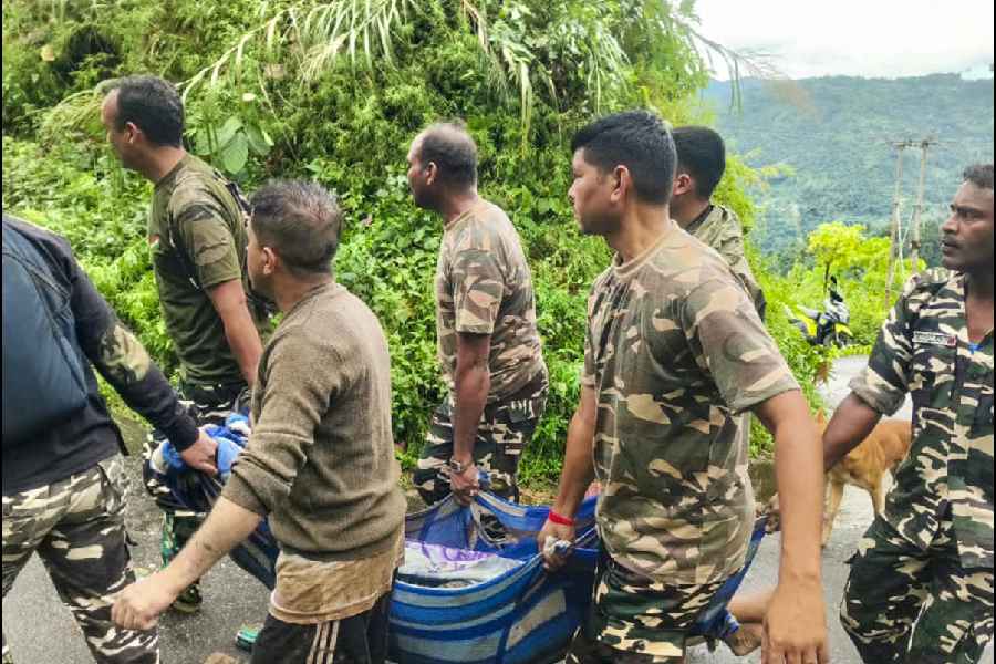 Rescue operation underway after landslides hit the area following heavy rainfall, in Darjeeling, Sunday, Oct. 5, 2025.