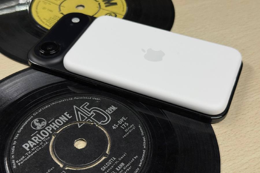 You can attach a MagSafe Battery for charging the phone.  