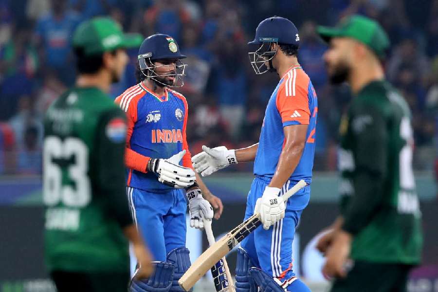 Tilak Varma (second from left) celebrates with Shivam Dube after reaching his half-centuryin the Asia Cup final against Pakistan in Dubai on September 28. The two sides clashed thrice during the tournament, with India winning all three games.