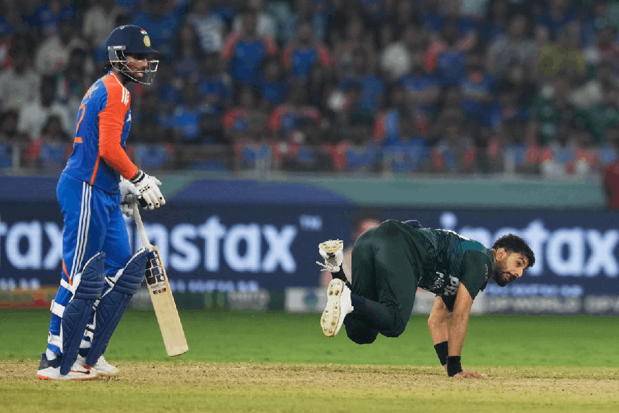 Pakistan's Haris Rauf loses his balance after bowling a delivery during the Asia Cup cricket final between India and Pakistan at Dubai International Cricket Stadium, United Arab Emirates, Sunday, Sept. 28, 2025.