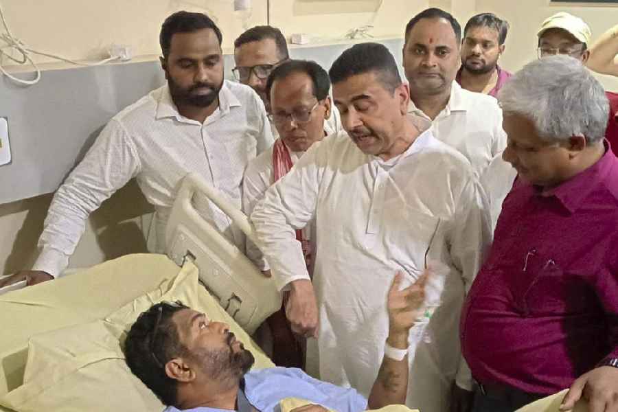 Leader of Opposition in West Bengal Assembly Suvendu Adhikari visits BJP MLA Shankar Ghosh, who is undergoing treatment following an attack on him by a mob in landslide-hit Nagrakata of Jalpaiguri district, at a private hospital at Matigara area, in Siliguri, West Bengal, Tuesday, Oct. 7, 2025.