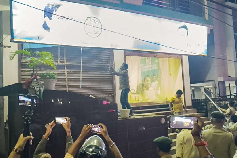 An alleged BJP worker vandalises Trinamool’s Tripura office in Agartala on Tuesday.