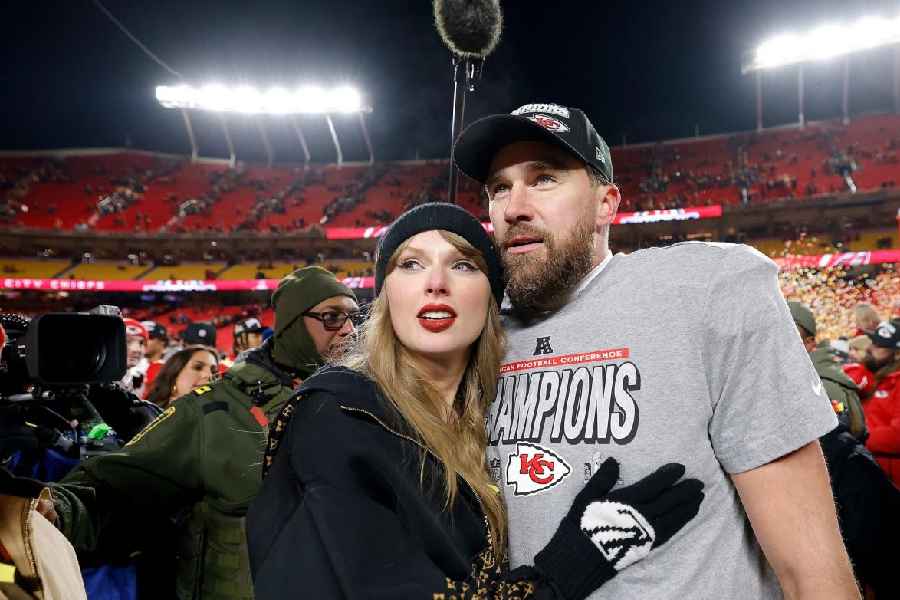 Taylor Swift celebrates with Travis Kelce after the Kansas City Chiefs defeated the Buffalo Bills in the AFC Championship Game in January 2025.