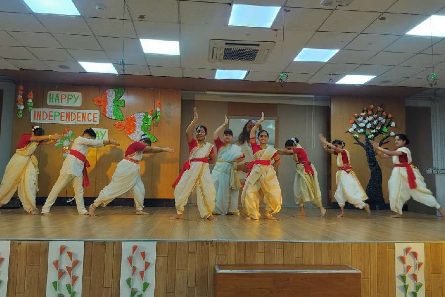 Students of Classes III to V present a dance performance to patriotic songs