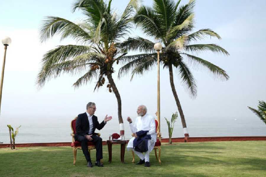 Arms and the men: British Prime Minister Keir Starmer with Prime Minister Narendra Modi at the Raj Bhavan in Mumbai on Thursday.