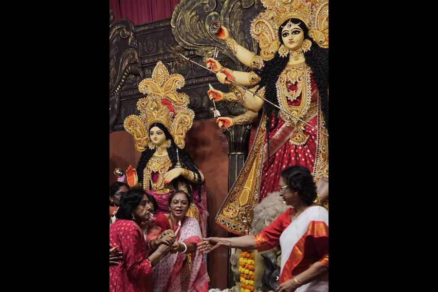 Sabitri Chatterjee (left) at the FE Block puja inauguration on Chaturthi.