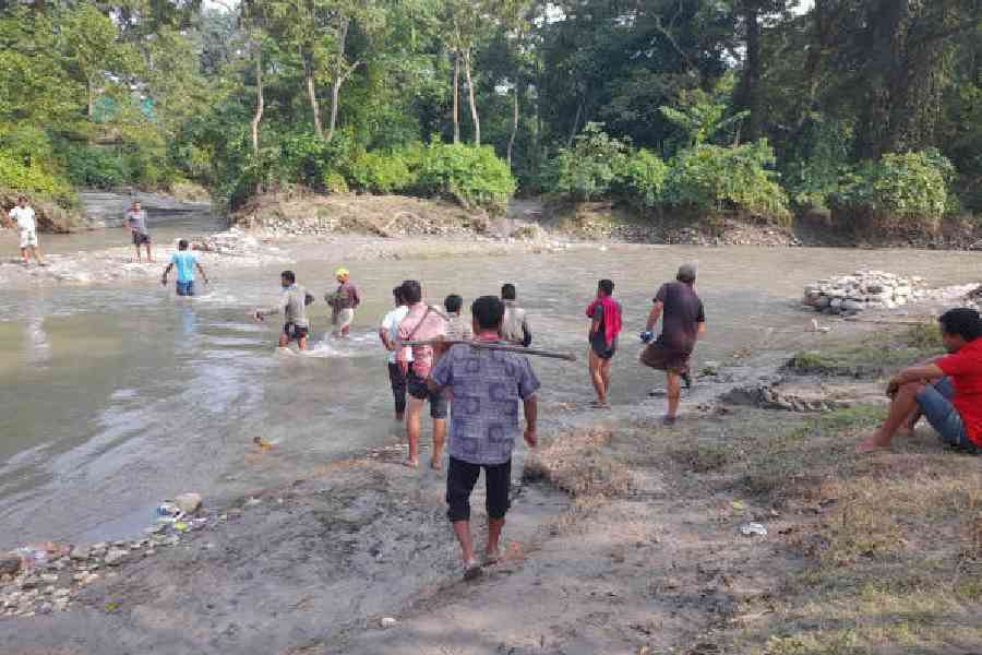 Work in progress on the construction of the diversion road beside the damaged Holong bridge in Alipurduar district on Tuesday.Picture by Anirban Choudhury