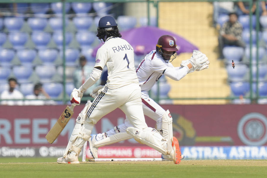 West Indies' wicketkeeper Tevin Imlach dislodges the bails to stump out India’s KL Rahul on day one of the second and final Test cricket match of a series between India and West Indies, at the Arun Jaitley Stadium, in New Delhi, Friday, Oct. 10, 2025.