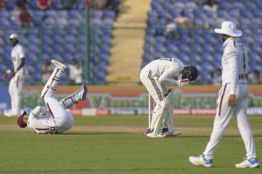 India captain Shubman Gill (Right) and West Indies' Tevin Imlach react after a collision on the opening day