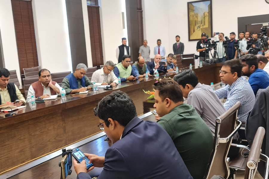 The all-male press room at the Taliban foreign minister’s press conference