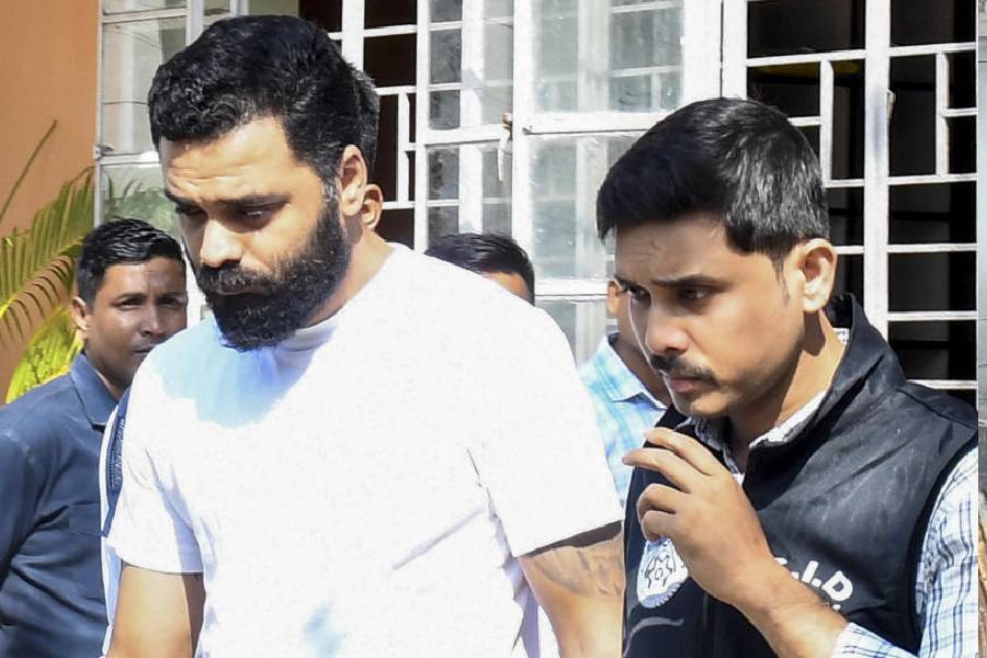 North East India Festival (NEIF) manager Siddhartha Sharma, allegedly involved in the death of late singer Zubeen Garg in Singapore, is brought to the CJM Court for hearing, in Guwahti, Assam, Wednesday, Oct. 15, 2025.