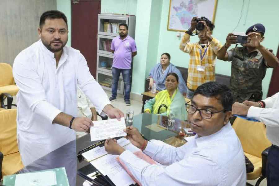 RJD leader and Leader of Opposition in Bihar Assembly Tejashwi Yadav files nomination from Raghopur constituency for the upcoming state Assembly elections, in Hajipur, Wednesday, Oct. 15, 2025.