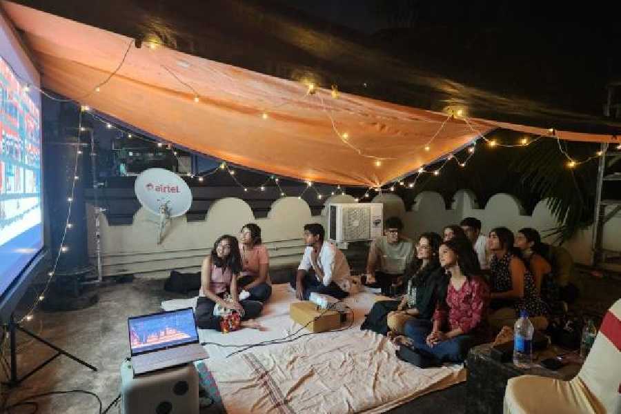 Students watch Zindagi Na Milegi Dobara on a GC Block terrace.