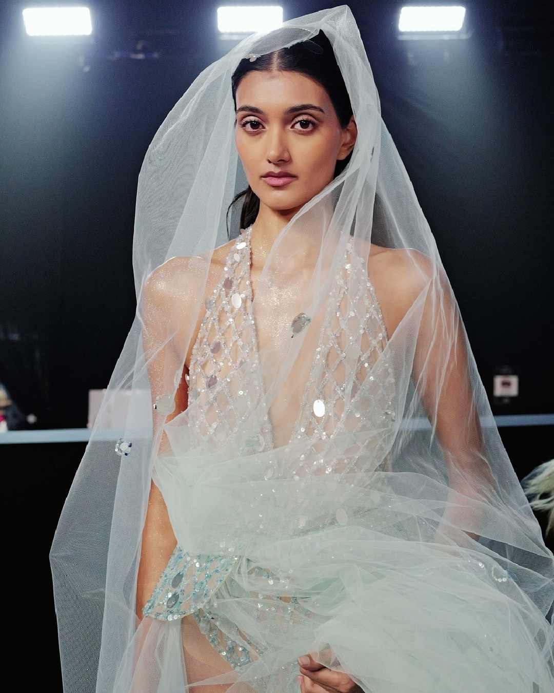 Neelam Kaur Gill, the only Indian-origin model to have walked the ramp at Victoria’s Secret Fashion Show in New York on Wednesday, turned heads in a shimmering pink set on the runway.