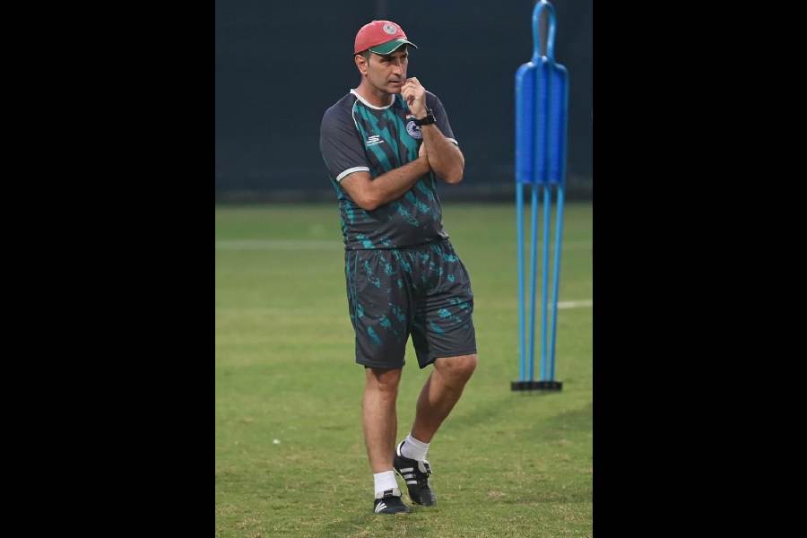 Bagan coach Jose Molina watches his boys train on Friday.