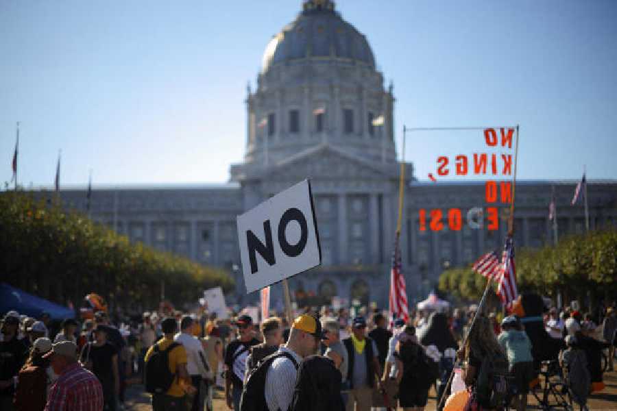 Demonstrators gather in front of San Francisco City Hall during a "No Kings" protest against U.S. President Donald Trump's policies, in San Francisco, California on Saturday.