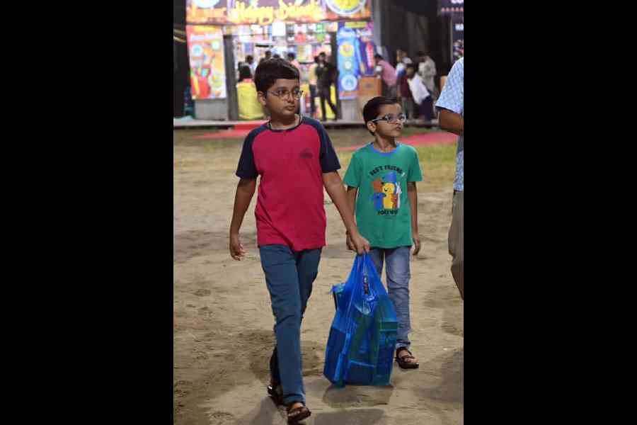 Customers shop for decorative diyas, candles, and firecrackers at Bazi Bazar, Shahid Minar ground
