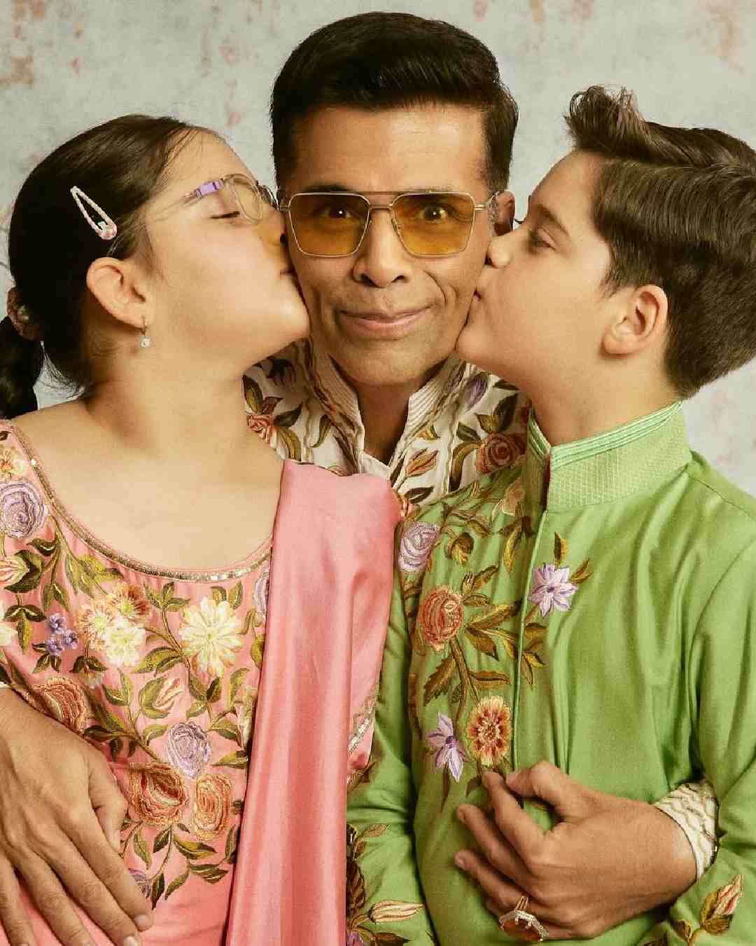 Filmmaker Karan Johar enjoyed the festival with his kids, Yash and Roohi. 
