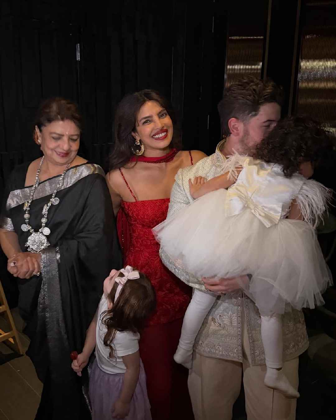 Nick and Priyanka posed for a family picture with mum Madhu, daughter Malti and one of Malti’s friends.  