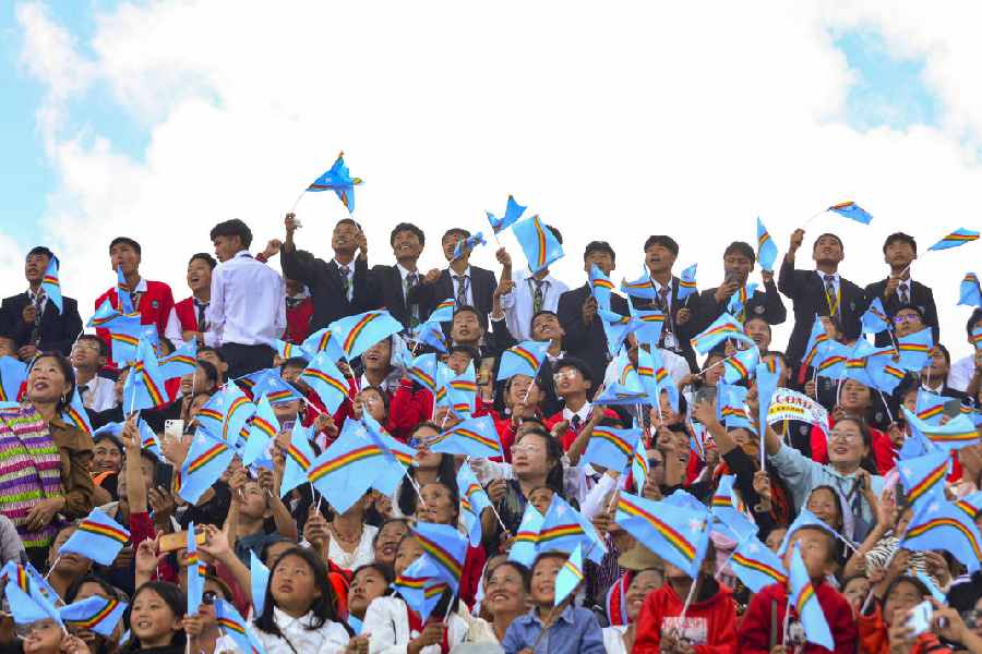 Nagas wave flags during the public reception of Muivah upon his arrival in Ukhrul on Wednesday.