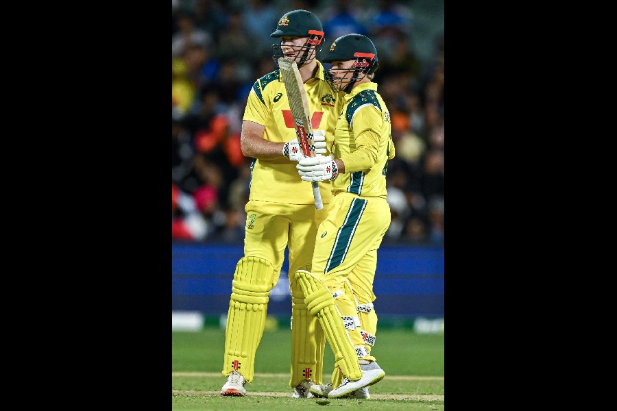 Cooper Connolly celebrates after reaching his half-century with Mitchell Owen (left), during his unbeaten 61 in Australia’s two-wicket win over India in Adelaide on Thursday.