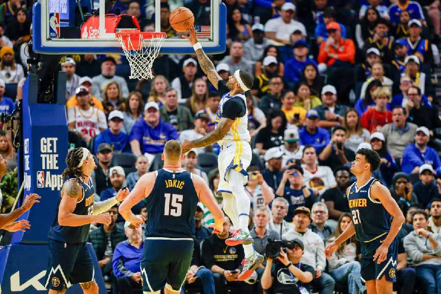 Oct 23, 2025; San Francisco, California, USA; Golden State Warriors guard Gary Payton II (0) puts up a shot against the Denver Nuggets during the second quarter at Chase Center
