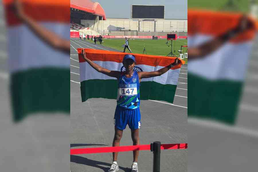 Palash Mandal poses with the Tricolour after winning bronze in the 5,000mt race-walk at the Youth Asian Games in Bahrain. Picture Courtesy: District Sports Association, Malda