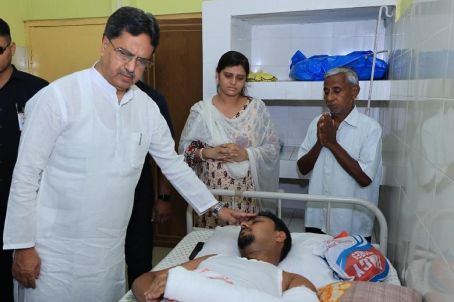 Chief minister Manik Saha meets a victim of the Santirbazar violence at a hospital on Friday